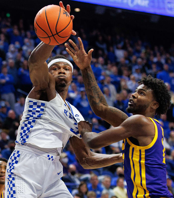 Kentucky Wildcats forward Oscar Tshiebwe (34) reaches for a rebound against LSU Tigers forward Tari Eason (13) during the second half at Rupp Arena at Central Bank Center.